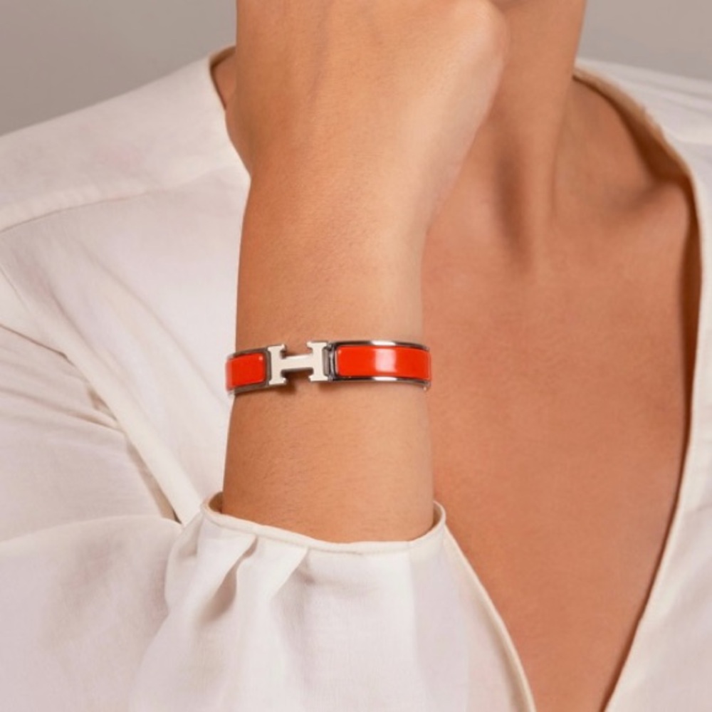 Make me an offer Hermes Clic H bracelet silver w/ orange & white enamel pm size